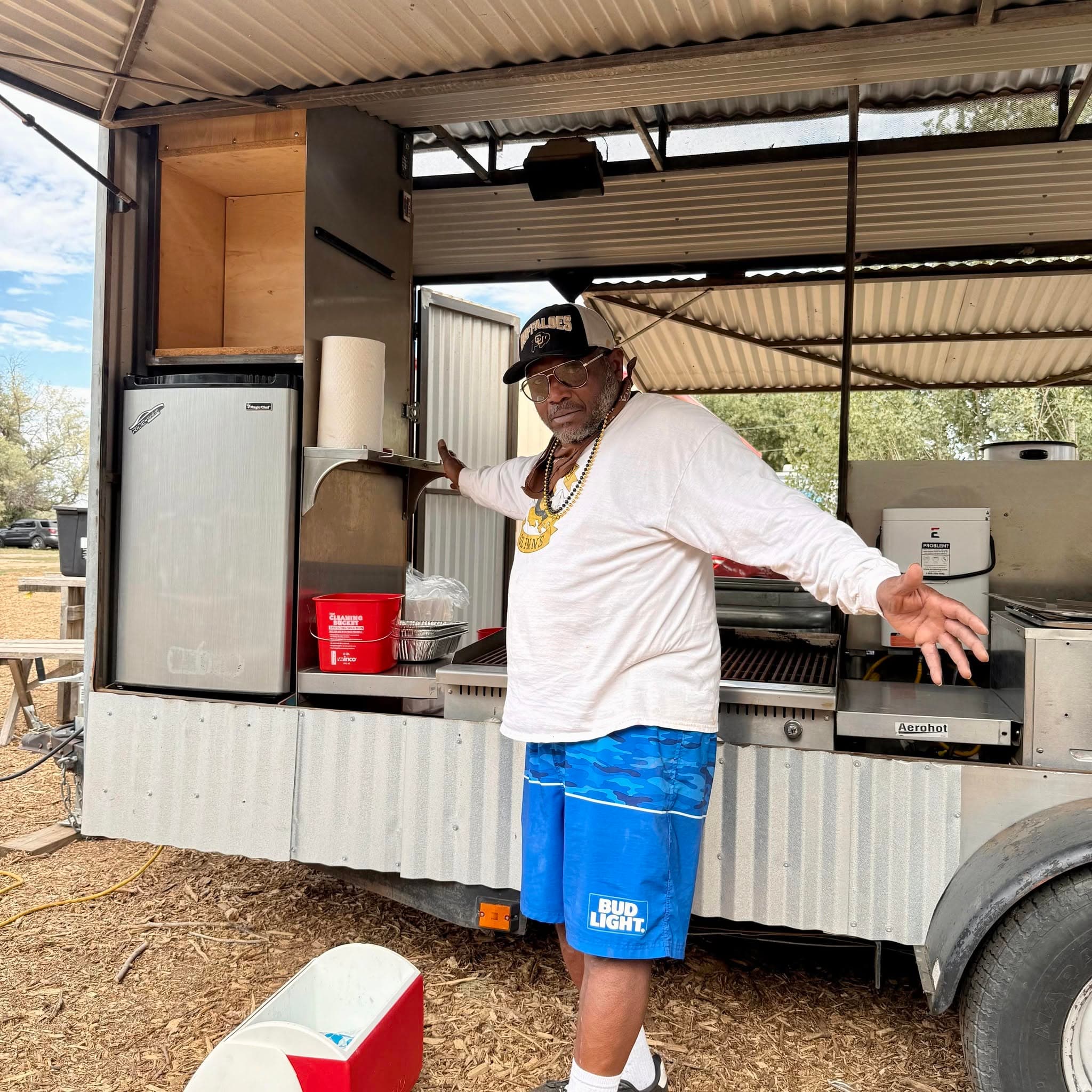 Owner operating the food truck grill